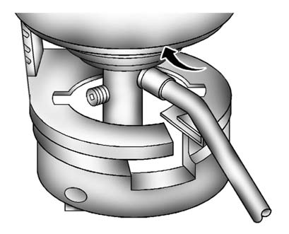 4. Turn the tire sealant canister (B) so the inflator filling hose is aligned